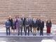 El presidente de la Junta de Andalucía, Juanma Moreno(c), acompañado del vicepresidente, Juan Marín (Cs)(3i) y el resto del Ejecutivo andaluz, en foto de familia en el Teatro Romano de Málaga, momentos antes de la reunión del Consejo de Gobierno que, hoy martes, se celebra en la capital malagueña dentro de la ronda por las ocho provincias andaluzas y fuera del Palacio de San Telmo en Sevilla. EFE/Carlos Díaz