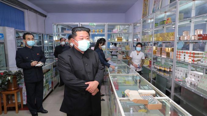 A photo released by the official North Korean Central News Agency (KCNA) shows North Korean leader Kim Jong-un (C) wearing a face mask while inspecting a pharmacy in Pyongyang, North Korea, 15 May 2022 (issued 16 May 2022). On 15 May, Kim held an emergency consultative meeting of the political bureau of the Workers' Party at the headquarters of the party's Central Committee in Pyongyang. In the meeting, Kim ordered the mobilization of soldiers to stabilize the supply of medicine in the capital. EFE/EPA/KCNA EDITORIAL USE ONLY
