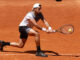 El tenista argentino Pedro Cachín golpea la bola contra el estadounidense Frances Tiafoe durante el partido de dieciseisavos de final que les enfrentó en el Mutua Madrid Open de tenis que se celebra en la Caja Mágica en Madrid. EFE/Chema Moya