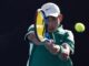 El tenista chino Juncheng Shang de China en acción contra el indio Sumit Nagal durante su partido de segunda ronda masculina del Abierto de Australia en Melbourne. EFE/EPA/MAST IRHAM