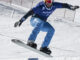 El español Lucas Eguibar, campeón mundial y ganador de la Copa del Mundo de boardercross de snowboard, durante la prueba de esta última competición que ganó en la estación española de Sierra Nevada (Granada).EFE/ Miguel Ángel Molina