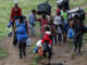 Fotografía de archivo fechada el 28 de septiembre de 2021 que muestra a migrantes haitianos en su camino hacia Panamá por el Tapón del Darién en Acandi (Colombia). EFE/ Mauricio Dueñas Castañeda