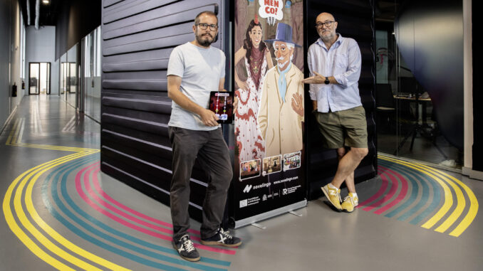 El director general de la empresa Novelingo, Daniel Cañete (i), y el guionista del videojuego 'Flamenco!', José Luis García, posan junto a un cartel de el nuevo videojuego desarrollado por esta empresa emergente malagueña, que propone un viaje musical por el flamenco que combina grabaciones originales, anécdotas y mucha historia, además de adictivas dinámicas de juego, de la mano del histórico cantaor y guitarrista El Piyayo. EFE/ Jorge Zapata
