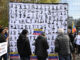 Un cartel muestra fotografías de presos políticos en Venezuela durante la manifestación de opositores políticos venezolanos que ha tenido lugar este domingo en Madrid.EFE/ Victor Lerena