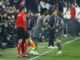 El centrocampista del Real Madrid Eduardo Camavinga (c) entra al campo por Modric durante el encuentro correspondiente a la jornada 17 de LaLiga EA Sports en el estadio de Vallecas, en Madrid. EFE / Juanjo Martín.