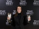 La jugadora del FC Barcelona Aitana Bonmatí posa con los galardonados recibidos, durante la gala de los Premios The Best celebrada este martes en Doha. EFE/FIFA via Getty Images/Alex Caparros