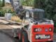 Cartel informativo de la Operación Asfalto para la renovación de calles en Altos de Jarama