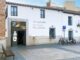 Cartel informativo de servicios municipales en El Caserón durante las Fiestas del Santísimo Cristo de los Remedios