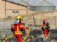 Bomberos trabajando en el control del incendio del Polígono Los Palancares de Cuenca